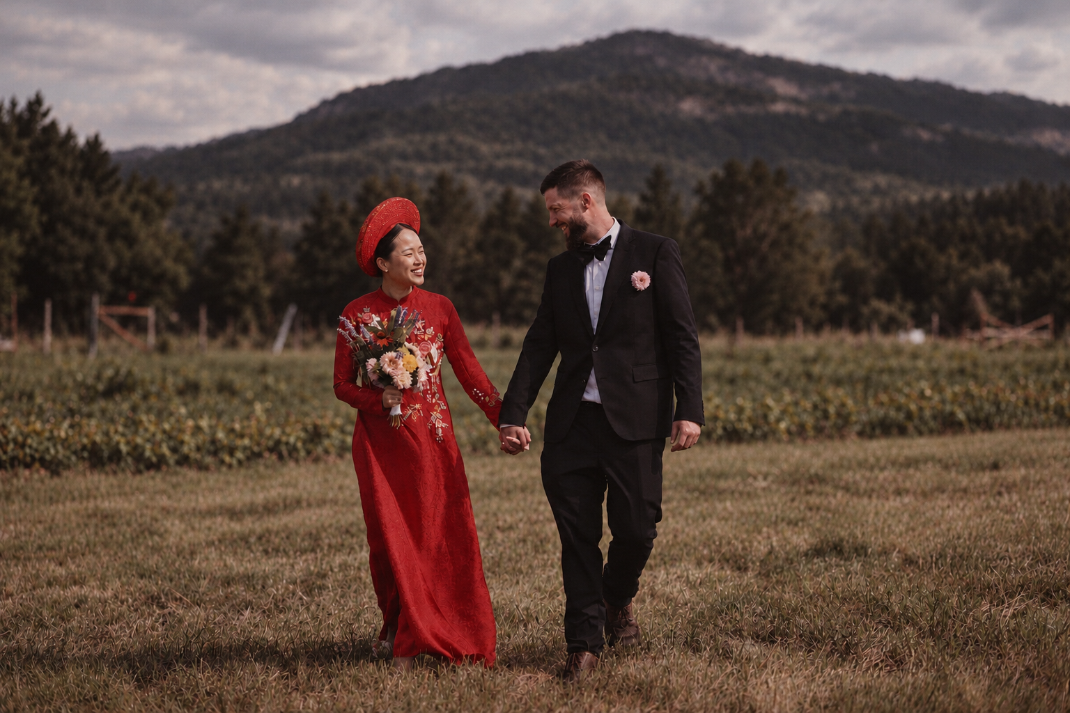Thu and Simon in a mountain meadow portrait in Rougemont, Quebec