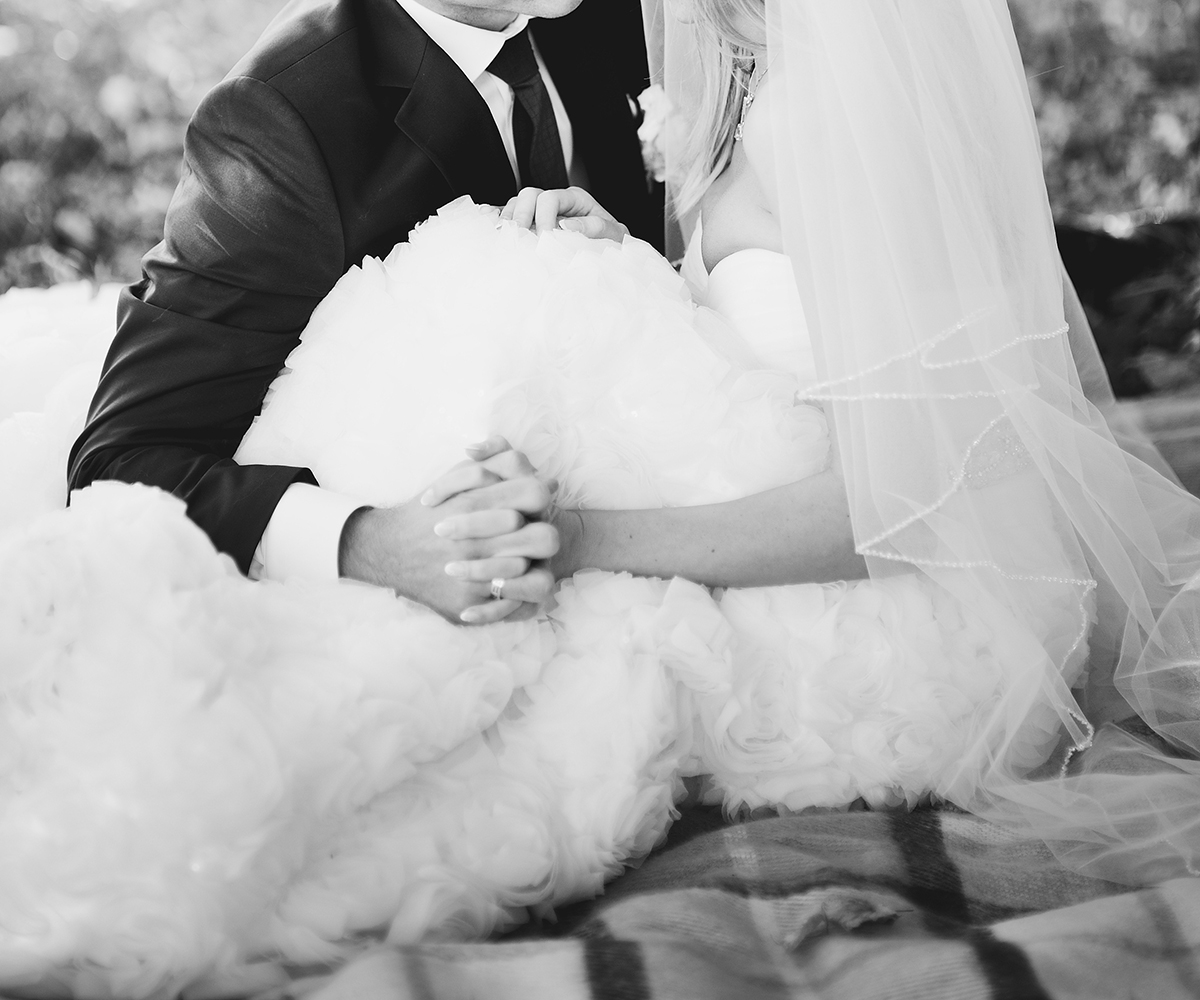 A bride and groom holding hands