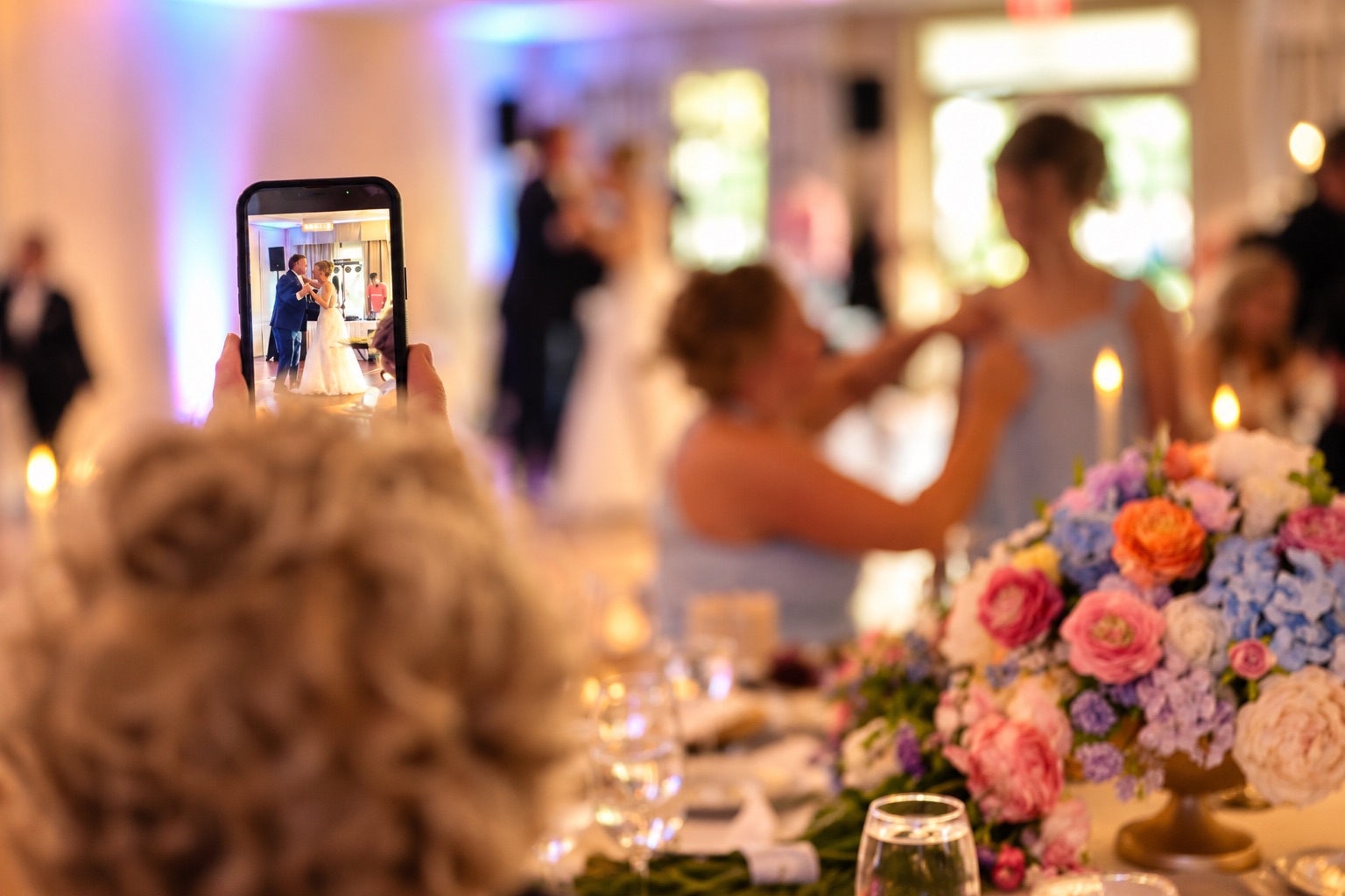 A guest films the first dance in Watertown, Upstate New York