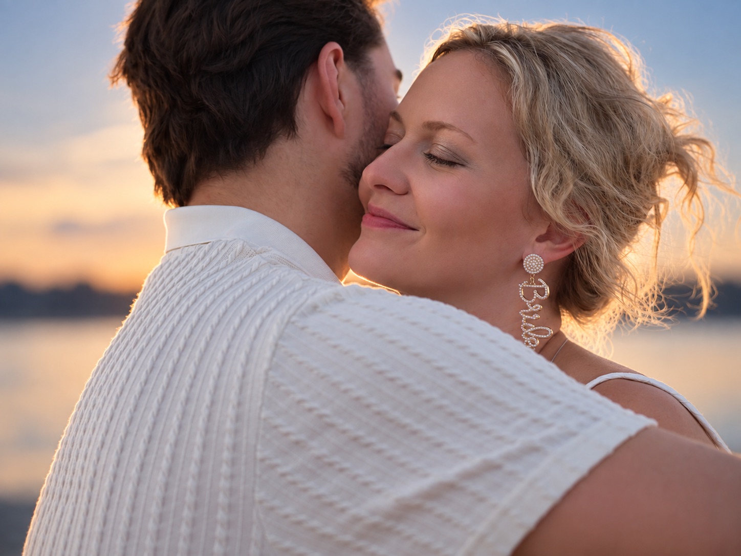 Jaci and Vincent embrace at sunset by the water in the Thousand Islands, Upstate New York