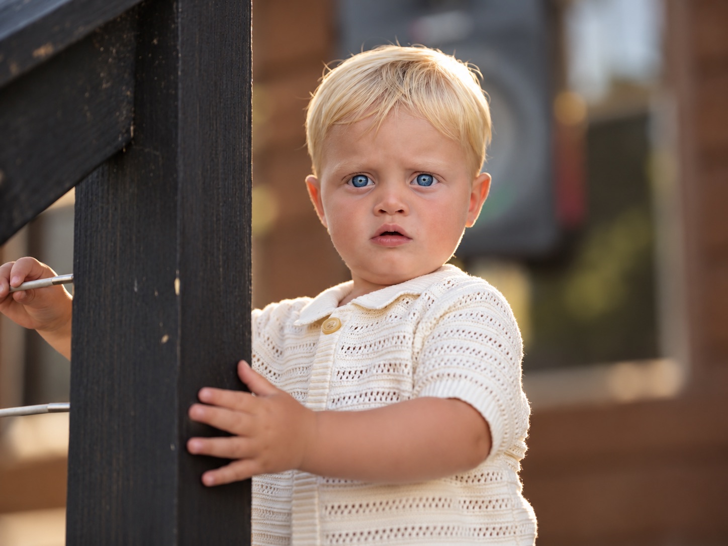 A toddler by the railing at the Watertown wedding, Upstate New York