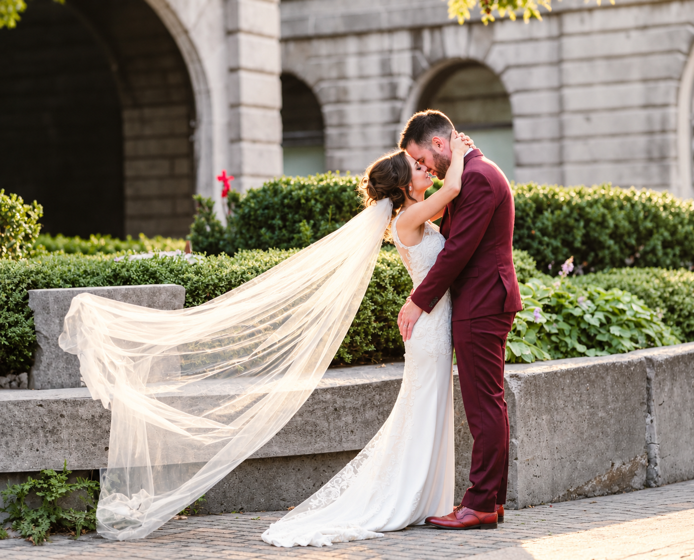 Kristine and Kenneth kissing with a flowing veil