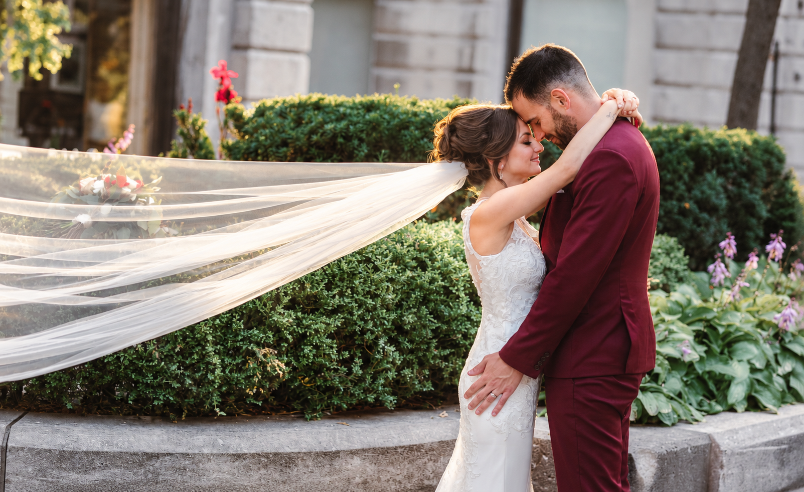 Kristine and Kenneth with her veil blowing in the wind