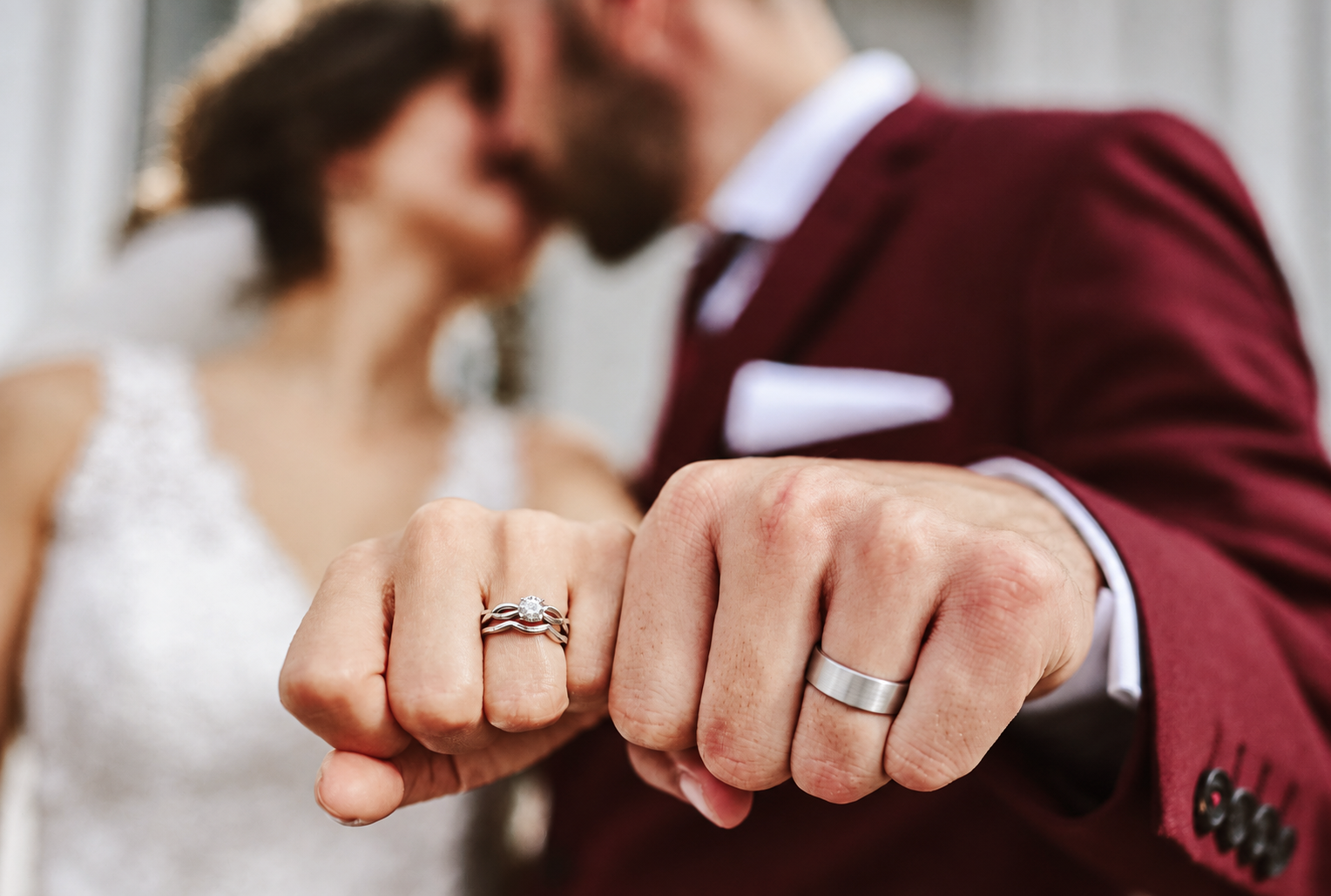 Wedding rings on Kristine and Kenneth's hands