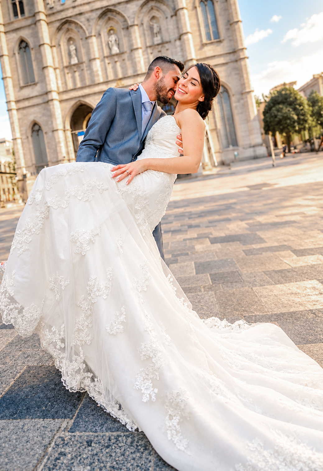Kevin kissing Sara's cheek in front of Notre-Dame Cathedral