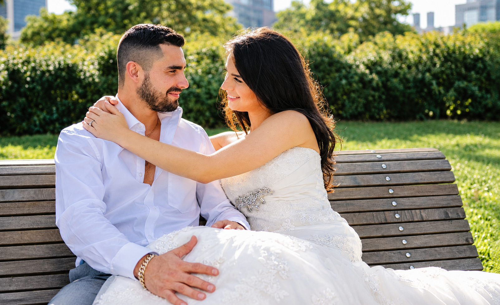 Sara and Kevin looking at each other on a park bench